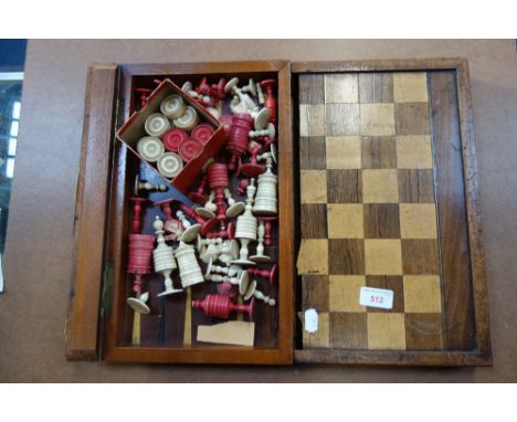 A COLLECTION OF 19TH CENTURY CHESS PIECES and draught pieces in a period chess board box