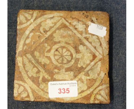 AN ENCAUSTIC MEDIEVAL TILE, 12.5cm wide