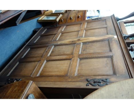 A 19TH CENTURY OAK CUPBOARD WITH PANELLED DOORS AND BRACKET FEET 135 cm wide