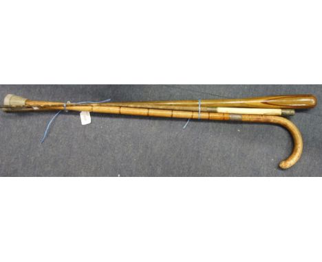 AN EDWARDIAN WALKING STICK with a silver band and two similar items