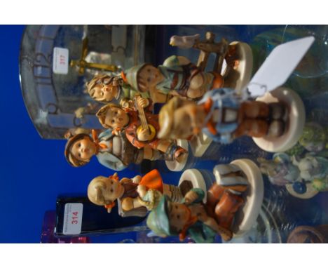 A COLLECTION OF GOEBEL HUMMEL FIGURES