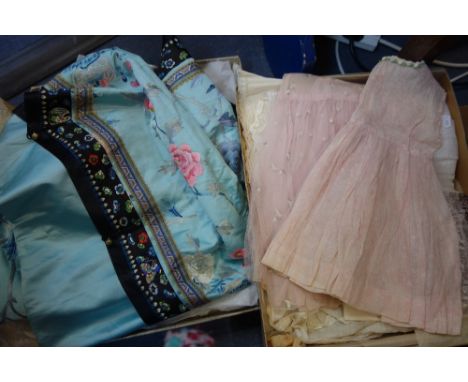 A BLUE SILK CHINESE ROBE with floral embroidery and geometric borders, a Kimono embroidered with Wisteria and other items of 