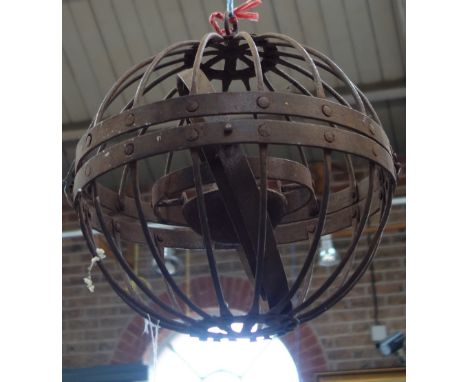 AN IRON "SHIP'S LANTERN" formed as three concentric swivelling rings within an iron spherical cage