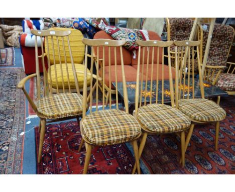 ERCOL; THREE VINTAGE STICK BACK ELM AND BEECH CHAIRS and a matching armchair (4)