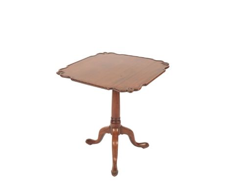 A GEORGE III MAHOGANY TRIPOD TABLE 18th century with alterations, the shaped dished top raised on a gun barrel turned column 