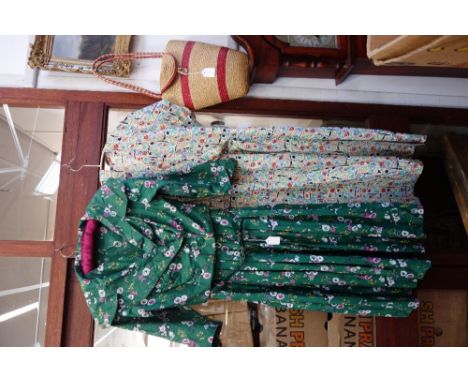 A VINTAGE 1950'S LADIES PRINTED COTTON DRESS by Melbray and a similar cotton summer dress and a woven straw handbag