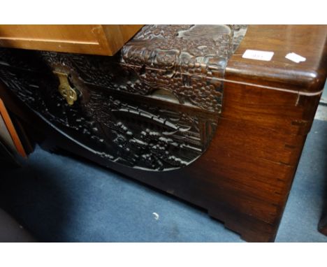 A CARVED CAMPHOR WOOD TRUNK