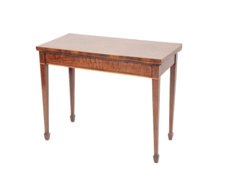 A LATE GEORGE III FIGURED MAHOGANY CARD TABLE with a crossbanded folding rectangular top enclosing a baize-lined interior, ov