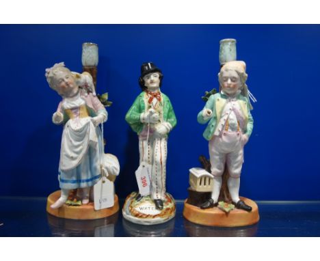 A PAIR OF 19TH CENTURY CONTINENTAL CERAMIC CANDLESTICKS and a Staffordshire figure, "Gin and Water" (3)