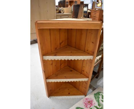A natural pine corner shelf