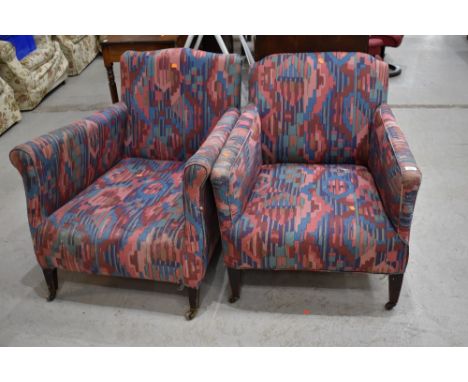 A pair of low deep set art deco lounge chairs , with later upholstery