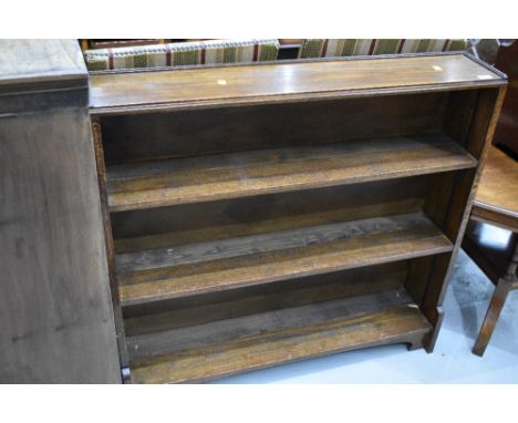 An Edwardian oak framed book shelf 97cm long and 92cm tall
