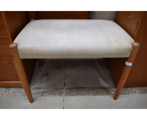 A vintage PVC dressing table stool having teak legs