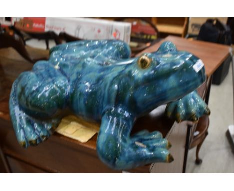 A large heavy cast ceramic tree frog figure in a teal blue and green glaze approx 65cm long