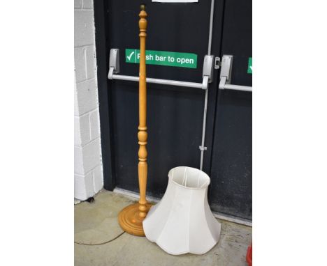 A wooden pine standard lamp