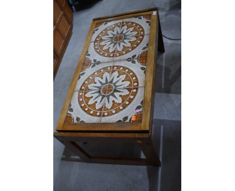 A vintage 1970's tile topped coffee table with hard wood body approx 95 long 47cm wide