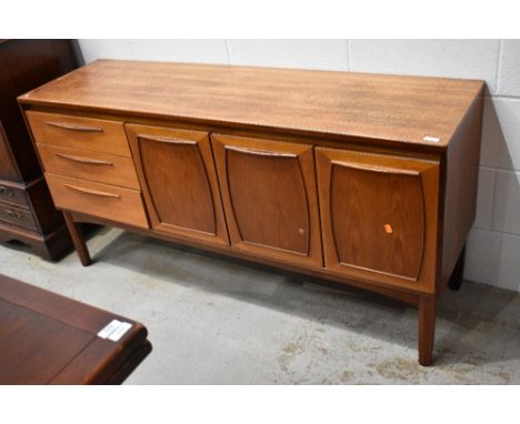 A vintage teak and laminate side board labelled Europa Furniture 150cm long 43cm deep and 74cm high some staining to top of u