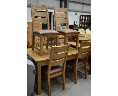 A modern light oak extending dining table and set of six matching chairs by Willis and Gambier
L 178CM X W 90CM X H 77CM
2 X 