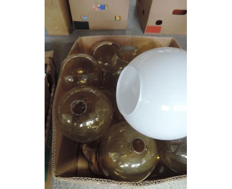A box of various glass light shades