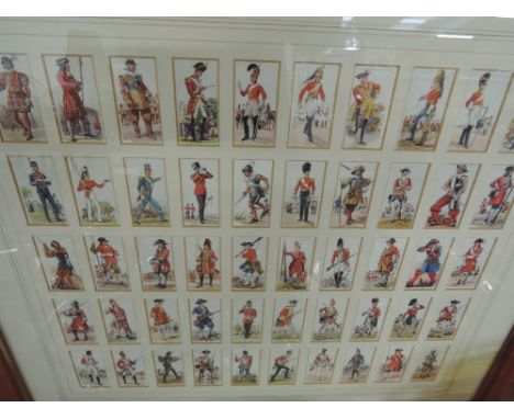 A framed set of cigarette cards 'History of Army Uniforms'
