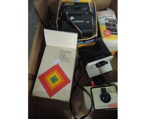 A box of Instant cameras, including Kodak EK260-EF, a Polaroid SX-70 land camera model 2, a Polaroid 1000 land camera, a Polo