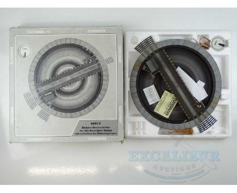 A FLEISCHMANN HO gauge 6651C electrically operated turntable, appears complete - G/VG in a G box