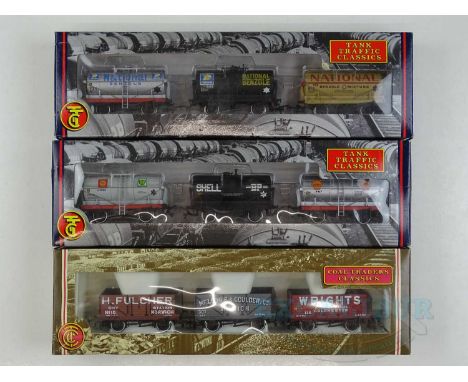 A group of BACHMANN OO gauge triple wagon packs comprising 2 x different Tank Traffic Classics and 1 x Coal Traders Classics 