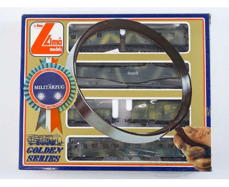 A LIMA HO gauge Militarzug German Outline Military train pack comprising diesel loco, mobile aircraft gun etc. - VG in G box