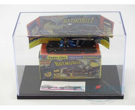 A CORGI 267 Batmobile in gloss black with gold hubs and pulsating flame complete with four missiles and original features lea