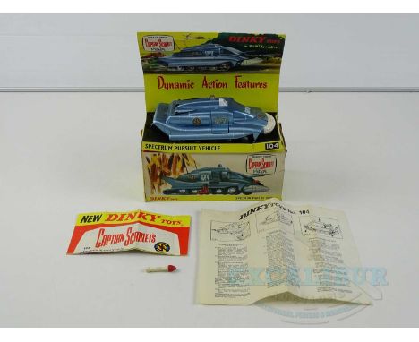 A DINKY 104 Gerry Anderson's 'Captain Scarlet' Spectrum Pursuit Vehicle in metallic blue, complete with missile, figure, inst