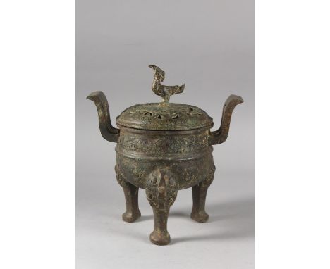 A CHINESE ARCHAIC STYLE BRONZE TWIN HANDLE TRIPOD CENSER, 28cm high.