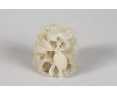 A VERY FINE SMALL 19TH CENTURY CHINESE JADE CARVING, depicting cranes and foliage with pierced openwork centre, 3cm high, 3cm