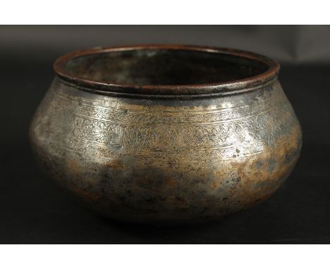 A RARE 14TH-15TH CENTURY ISLAMIC ENGRAVED TINNED COPPER BOWL, with calligraphy and Arabesque decoration, 19cm wide.