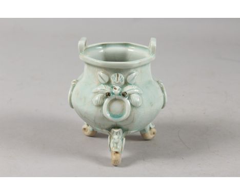 A CHINESE YING CHING GLAZE POTTERY TRIPOD CENSER, with moulded and carved relief decoration, together with original wooden bo