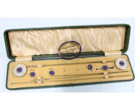 Edwardian gilt metal and purple enamel dress set comprising two mother of pearl hatpins, a buckle, three buttons and a a broo