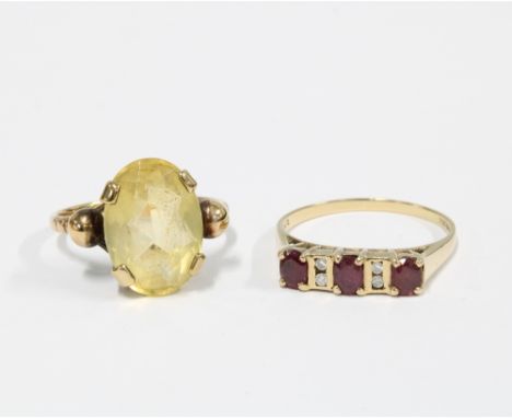 9ct gold ruby and diamond dress ring, size Q, and another dress ring with a claw set oval citrine on an unmarked yellow metal