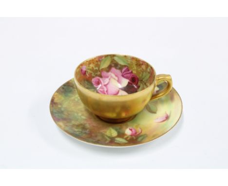 Royal Worcester handpainted cabinet cup and saucer with rose and gilded interior, marked Twin (2) 