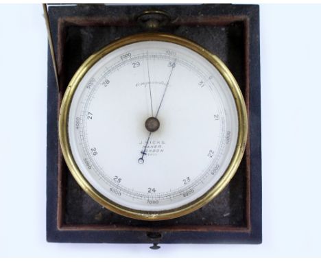 A J.HICKS ANEROID BAROMETER with a brass case, 12cm diameter in a fitted box 