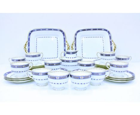 AN EARLY 20TH CENTURY WEDGWOOD PORCELAIN TEA SERVICE with blue and gold decoration to include twelve teacups, eleven saucers,