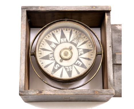 A 19TH CENTURY GIMBALLED SHIP'S COMPASS with a compass card, and a painted pine case, the compass dial 18cm diameter