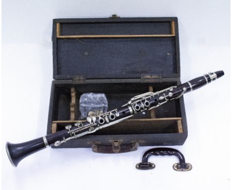 AN EARLY 19TH CENTURY ROSEWOOD CLARINET  by E J Albert of Brussels, and with retailers stamp for J R La Fleur & Son of London