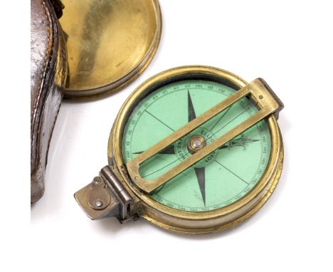 A 19TH CENTURY BRASS CASED COMPASS by Elliott Brothers of London with green coloured card dial and prismatic sight, the case 