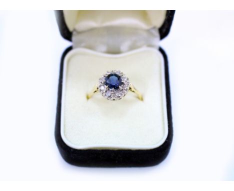 AN 18 CARAT YELLOW GOLD SAPPHIRE AND DIAMOND CLUSTER RING size O, weighs 3.3 grams approximately overall