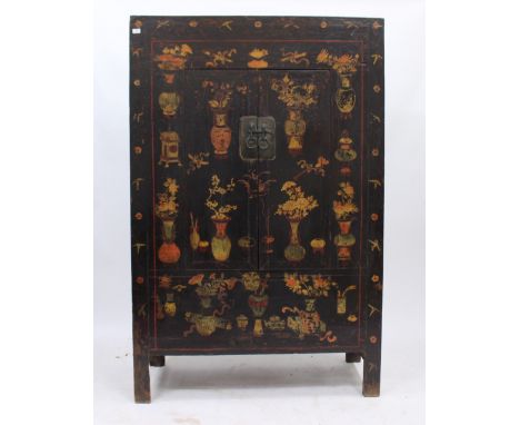 AN ORIENTAL PAINTED CUPBOARD  decorated with vases of flowers and lucky symbols, the twin doors opening to reveal two drawers