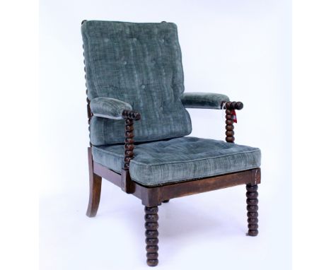 A 19TH CENTURY BOBBIN TURNED ARMCHAIR with a caned seat and button upholstered cushions, 62cm wide x 102cm high x 66cm deep