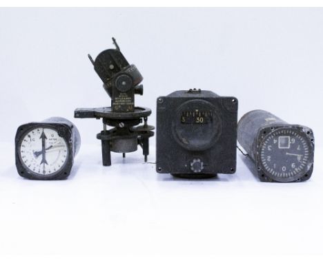 A GROUP OF FOUR MILITARY AEROPLANE INSTRUMENTS consisting of a Directional Gyro ark IB circa 1944, a radio altimeter, a G met