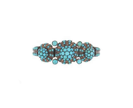 An Etruscan revival style turquoise bangle, front section with three central circular turquoise cluster panels connected to a