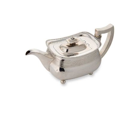 A George III silver teapot, mark of Charles Chesterman II, London 1809, of rectangular form with reeded side and gadrooned pa