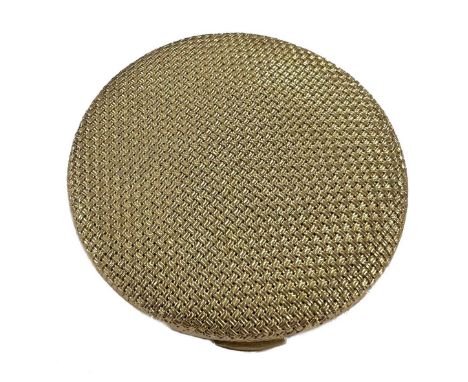 A mid 20th century powder compact, retailed by Gübelin, of circular basket weave design, piano hinge and push button thumbpie