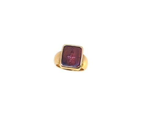 A hardstone intaglio ring, octagonal head set with a cornelian engraved with a coat of arms, head dimensions 14.7 x 12.9mm, s